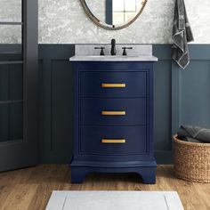 a bathroom vanity with a mirror above it and a rug on the floor next to it