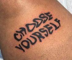 a man with a tattoo on his arm that says, sorry yourself