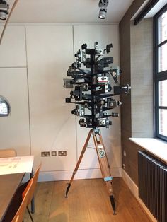 a tripod is set up in front of a window