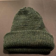 This soft green hat is made with 20% wool & 80% acrylic yarn. It is hand-spun and will keep you warm this winter season. one size fits most. Butte Mt, Green Hat, Green Hats, Green Wool, Skull Cap Beanie, Skull Cap, Hand Spinning, Beanie Hat, Winter Season