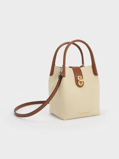 Bucket Bag Style, Canvas Bucket Bag, Charles Keith, Bag Style, Sustainable Materials, Tan Brown, Bucket Bag, Adjustable Straps, Handles