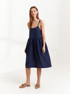 "DULCE is a linen strappy dress. DETAILS - Spaghetti straps - Below the knee length - Smock silhouette - Pockets - 100% lightweight European linen fabric - Cut and sewn to order just for you in our studio COLOR - Navy Blue, you can also choose other colors above - Fabric samples are available here https://www.etsy.com/listing/586569696/linen-fabric-samples SIZING & FIT - Fits true to size - Measurements taken from a size XS - Model is 5'8.9\" / 175cm and wearing a size XS CARE FOR LINEN - Ma Summer A-line Midi Dress With Straps, Summer Knee-length Suspender Dress With Adjustable Straps, Chic Linen Sundress With Adjustable Straps, Blue Midi Length Suspender Dress For Summer, Blue Midi Suspender Dress For Summer, Casual Strap Dresses For Daywear, Linen Sundress With Adjustable Straps For Summer, Sleeveless Linen Dress With Adjustable Straps For Brunch, Summer Dress With Spaghetti Straps Unlined