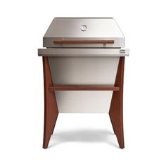 an image of a grill that is white and brown with wood trimmings on it