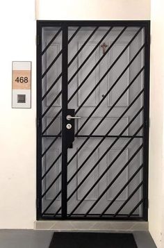 a black door with bars and numbers on it