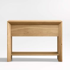 a wooden table with one drawer on the top and two shelves below it, against a white background