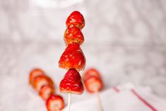 strawberries are stacked on top of each other