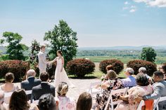 a bride and groom standing at the end of their wedding ceremony