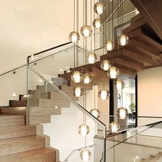 a staircase with glass balconies and lots of lights