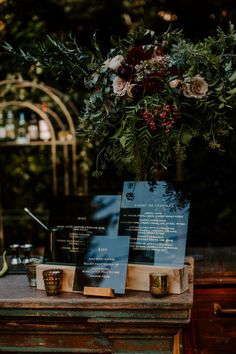 a table with menus and flowers on it