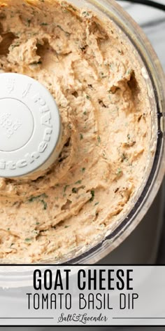 a food processor with hummus in it and the words goat cheese tomato basil dip