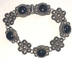 From an Atlanta estate, this is a really lovely vintage Mexican sterling silver onyx stone floral panel bracelet dating to the 1980s-90s.  It's is heavy and well made, weighing over 47 grams, and it consists of alternating onyx and silver panels..  It feels great on the wrist and is from Taxco Mexico.   It's marked MEXICO TC-140 925 and the clasp is nice and easy to use. The bracelet is in very good vintage used condition showing minimal wear, no damage, and no repair.  I'm selling as found, unp Sterling Bracelets, Funky Jewelry, Bracelet Vintage, Vintage Mexican, Fantasy Jewelry, Onyx Stone, Dress Jewelry, Jewelry Inspo, Dream Jewelry