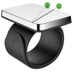 a ring with two green balls on it and an object attached to the front of it