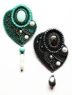 two pieces of beaded jewelry on a white surface, one is green and the other is black