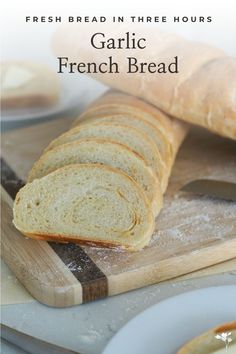 Two loaves of bread on a wooden cutting board, with slices of bread around them on plates. Garlic French Bread, Homemade Breadcrumbs, French Bread Loaf, French Bread Recipe, Bread Soft, No Rise Bread, Fresh Bread, French Bread, Baking Sheets