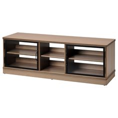 a wooden entertainment center with shelves and doors