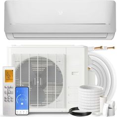 a white air conditioner sitting on top of a wall next to a phone and an appliance