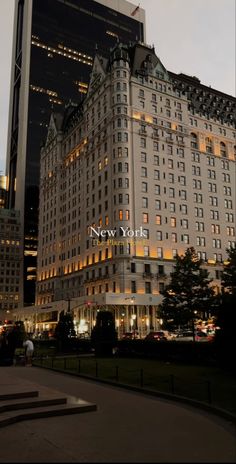 the new york hotel is lit up at night