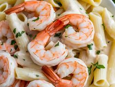 pasta with shrimp and cream sauce in a white bowl