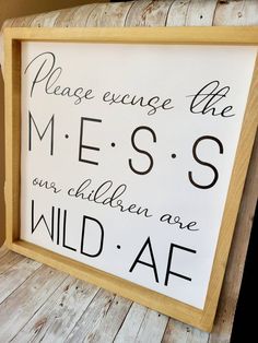 a wooden sign that says please exchange the mess, son children are wild af