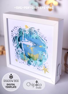 the shadow box is designed to look like an underwater scene