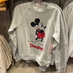 Brand New Pullover Sweatshirt Classic Mickey Screen Art For Vintage Styling Classic Disneyland Logo Soft Knit Fabric Long Raglan Sleeves Ribbed Crew Neck, Cuffs And Hem Enhanced Stitching Fleece Fabrication Interior Part Of The Standing Mickey Mouse Collection For The Whole Family The Bare Necessities 50% Cotton / 50% Acrylic Imported Disneyland Sweater, Disneyland Logo, Mickey Mouse Classic, Disneyland Mickey Mouse, Lilo And Stitch Ohana, Mickey Mouse Outfit, Short Faux Fur Jacket, Classic Mickey Mouse, Screen Art