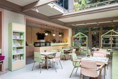 the inside of a restaurant with tables and chairs