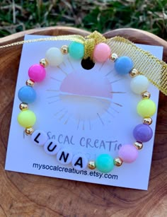 This listing is for ONE Personalized Name or Word bracelet made with a sweet mix of Round 8mm Pastel beads and 4mm 18k gold plated accent beads.  Every bracelet will be unique!! 💖🌟 Fun & Trendy Bracelets Customized Just For You!  Each piece is perfect on its own or layered with even more bracelets! Have fun creating your own unique stack!  ⭐️Customize with your choice of name, word, initials etc!  Just leave all personalization requests in a note during checkout (note to seller box). Include all information including heart beads and letter bead color.  ⭐️All letter Beads are capitalized. Please review all spelling and details prior to checkout.  ⭐️Measure your wrist for a custom fit! Add 1/4" to your wrist size for a snug fit. Add 1/2" to your wrist size for a comfort fit. I recommend a Name Bracelet Beads, Toddler Jewelry, Pastel Bracelet, Bracelet Name, Pastel Beads, Bracelet Craft Diy, Word Bracelet, Lil Sis, Trendy Bracelets