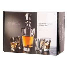 three glasses and a decanter in front of a box with the label tribeca five piece crystal whiskey set