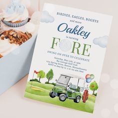 a pink golf cart themed birthday party with cupcakes and other items in the box