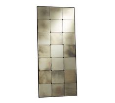 a large mirror that is on the wall in front of a white background, it looks like an abstract piece of art