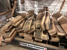 several pieces of wood sitting on top of a conveyor belt