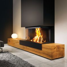 a modern fireplace in the middle of a living room