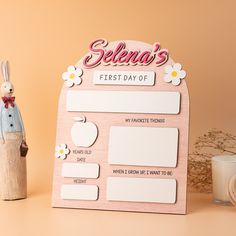 a wooden sign that says selena's first day of school