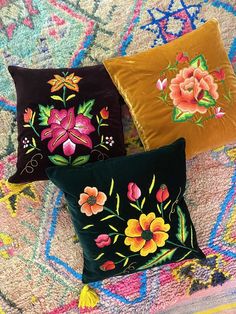 Hand embroidered floral velvet pillows made in Oaxaca, Mexico by Dona Mila and other artisans from the Isthmus of Tehuantepec. The floral patterns on the pillows are the ones traditionally used to adorn the gala costumes worn by the Tehuanas . The artisans use either hand embroidery or chain stitch technique to complete intricate flowers. All pillows are one of kind. Come in Royal blue, black and dark green velvet. Square 20” by 20”. Lumbar 24” by 13” Dry clean only. Sold with insert. Green Plum, Green Bouquet, Embroidered Velvet, Pink Bouquet, Orange Roses, Velvet Pillows, Chain Stitch, Green Velvet, Floral Patterns