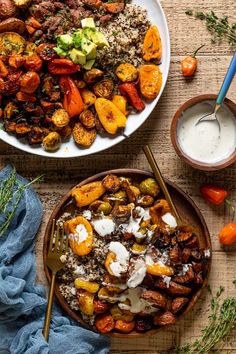 two bowls filled with different types of food on top of a wooden table next to blue napkin