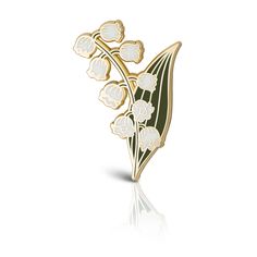 a brooch with white flowers on it