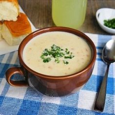 a bowl of soup on a blue and white checkered table cloth