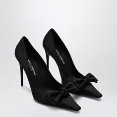 Hey there. Check out these stunning black pumps that are both chic and comfortable, perfect for a night out or adding a touch of elegance to your day. They’ve got that classic vibe but with a fun twist thanks to a cute bow. Trust me, slipping into these is like a little fashion party for your feet. Pointed bow design for a playful yet sophisticated look Logo-embellished insole adds a subtle designer touch High stiletto heel for the ultimate style statement Leather sole for durability and comfort Classic Vibe, Bow Women, Satin Noir, Satin Pumps, Dolce E Gabbana, Leather Cap, Bow Design, Sneaker Heels, Emilio Pucci