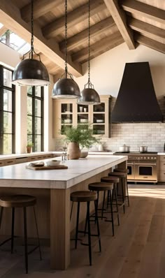 a kitchen with an island and several stools