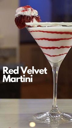 a red velvet martini is garnished with whipped cream