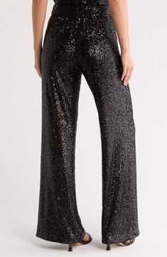 Shimmering sequins catch the dance floor lights on glamorous pants fashioned with a wide leg silhouette for a standout statement style. 12" rise; 35" inseam (size 2) 92% polyester, 8% spandex Dry clean Imported Sequin Pants Outfit Night Out, Sequins Pants Outfit, Dance Floor Lighting, Sequin Pants, Black Sequins, Night Outfits, Pants Outfit, Fashion Pants, Night Out