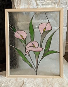 a glass painting with pink flowers on it