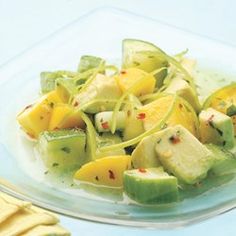 a glass plate filled with sliced up fruit