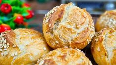 several loaves of bread with sesame seeds on top