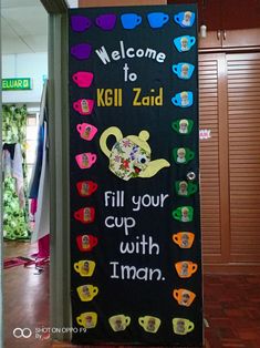 a welcome sign for kili zaid with teapots and flowers on it