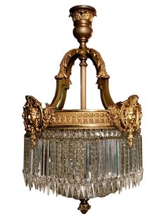 an antique chandelier with glass beads hanging from the ceiling