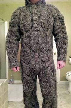 a man in a knitted suit standing in front of a toilet