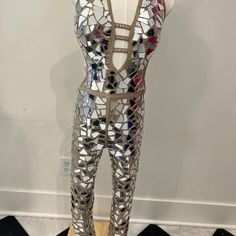 a mannequin made out of mirrored tiles