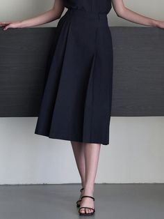 Classic mood skirt that made of cotton blended fabric. Featuring the pin tuck detail throughout the skirt, and the A-line silhouette that gives feminine mood. We recommend style with 'Sand collar blouse' to create classic set-up look. - Pin tuck detail at front and back- Console zipper closure at side seam- Midi length and A-line silhouette skirt- Set-up product with 'Sand collar blouse' Classic A-line Skirt For Daywear, Elegant A-line Pleated Skirt For Daywear, Chic Cotton A-line Pleated Skirt, Elegant A-line Cotton Skirt, Chic A-line Skirt For Semi-formal Occasions, Elegant Cotton A-line Pleated Skirt, Cotton A-line Pleated Lined Skirt, Elegant Cotton Skirt, Classic Cotton Pleated Skirt With Accordion Pleats