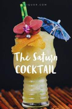 the satsum cocktail is served in a tall glass with an orchid and umbrella on top